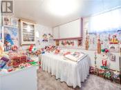 <p>The second bedroom hosts the bulk of the themed clowns, like Loonette and Ronald McDonald. (Zoocasa) </p>