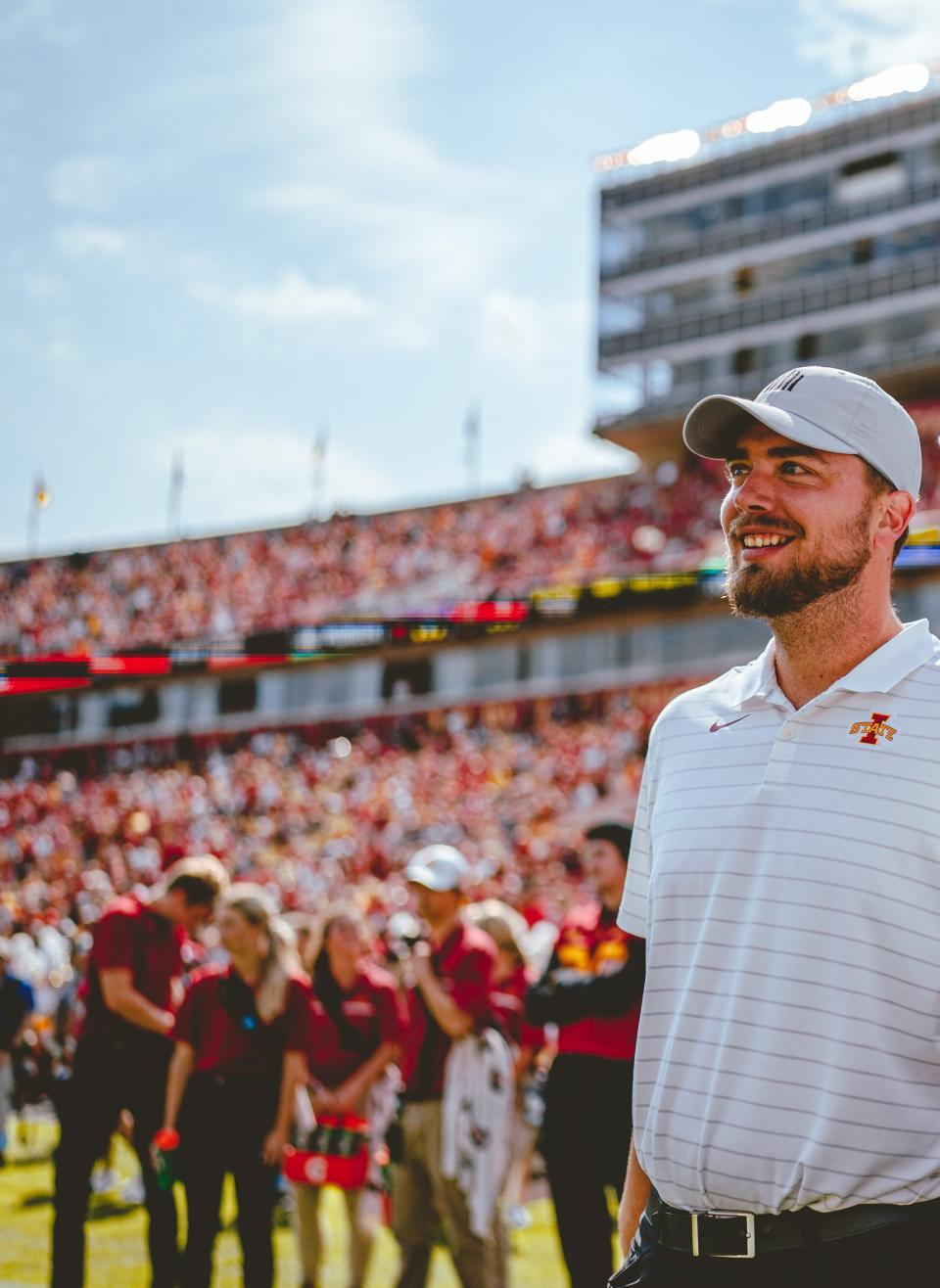 Iowa State's director of player personnel Derek Hoodjer stands on the sideline at Jack Trice Stadium ahead of a Cyclones football game.