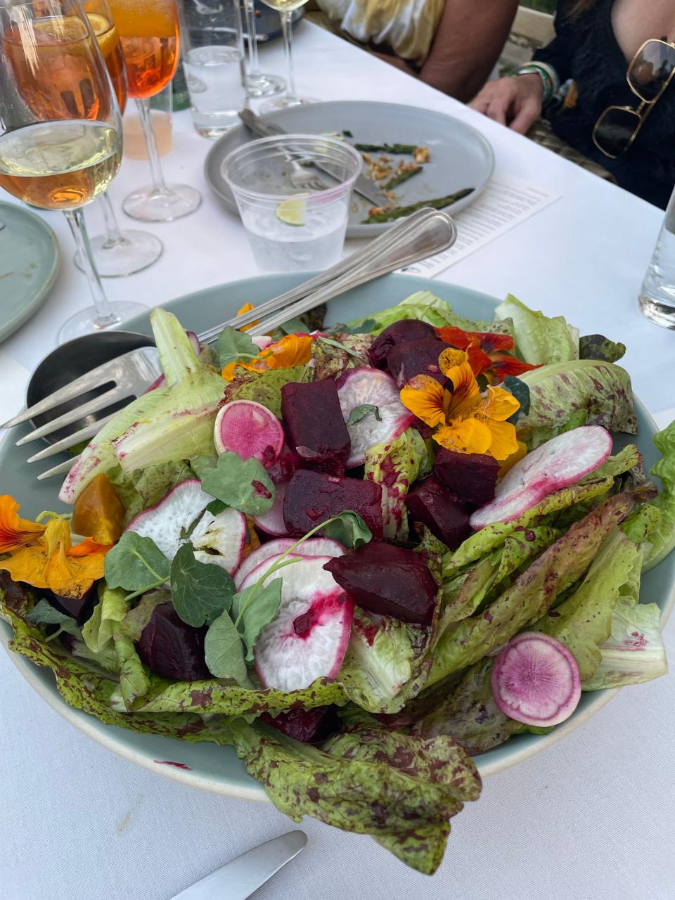 A salad with Coleman Family Farms freckled lettuce, Sage Mountain Farm beets, Aziz Farm radishes and Mandarin orange vinaigrette.