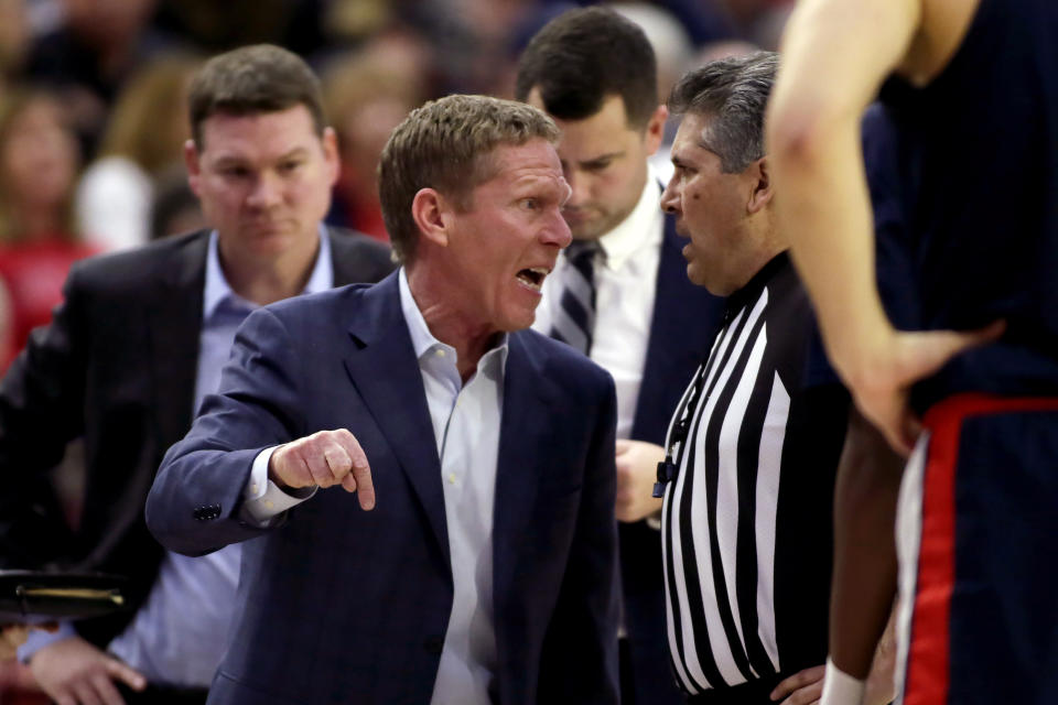 Gonzaga head coach Mark Few, center, has words with a referee during the second half of an NCAA college basketball game against Loyola Marymount in Los Angeles, Saturday, Jan. 11, 2020. (AP Photo/Alex Gallardo)