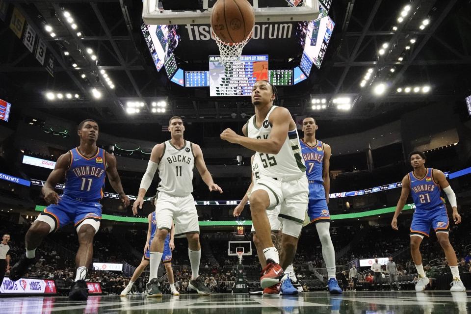 Milwaukee Bucks' Justin Robinson goes after a loose ball during the second half of an NBA preseason basketball game against the Oklahoma City Thunder Sunday, Oct. 10, 2021, in Milwaukee. (AP Photo/Morry Gash)