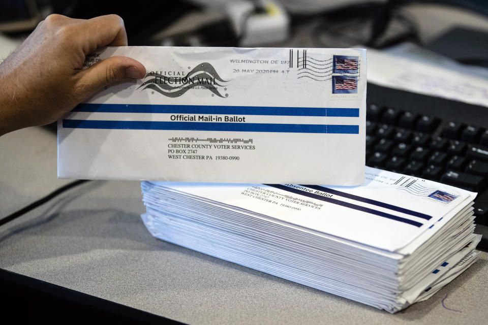 FILE - In this May 28, 2020, file photo, mail-in primary election ballots are processed at the Chester County Voter Services office in West Chester, Pa. With concerns rising in Pennsylvania that tens of thousands of mail-in ballots will be discarded in the presidential election over technicalities, officials in the battleground state told counties that they aren't allowed to reject a ballot solely because an election official believes a signature doesn't match the signature in the voter’s file. (AP Photo/Matt Rourke, File)