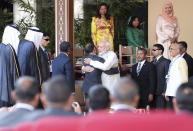 Indian Prime Minister Narendra Modi, center right, hugs Maldives’ former president Mohamed Nasheed during the swearing-in ceremony of President elect Ibrahim Mohamed Solih in Male, Maldives, Saturday, Nov. 17, 2018. Thousands of people cheered Solih, from the Maldivian Democratic Party, at a swearing-in ceremony Saturday in a soccer stadium chosen to accommodate a large number of his supporters. (AP Photo/Mohamed Sharuhaan)