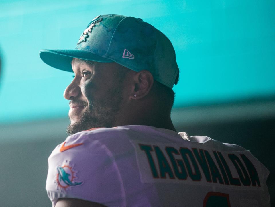 Miami Dolphins quarterback Tua Tagovailoa smiles in the tunnel prior to the start of the game between the host Dolphins and the Houston Texans at Hard Rock Stadium on Nov. 27, 2022, in Miami Gardens.