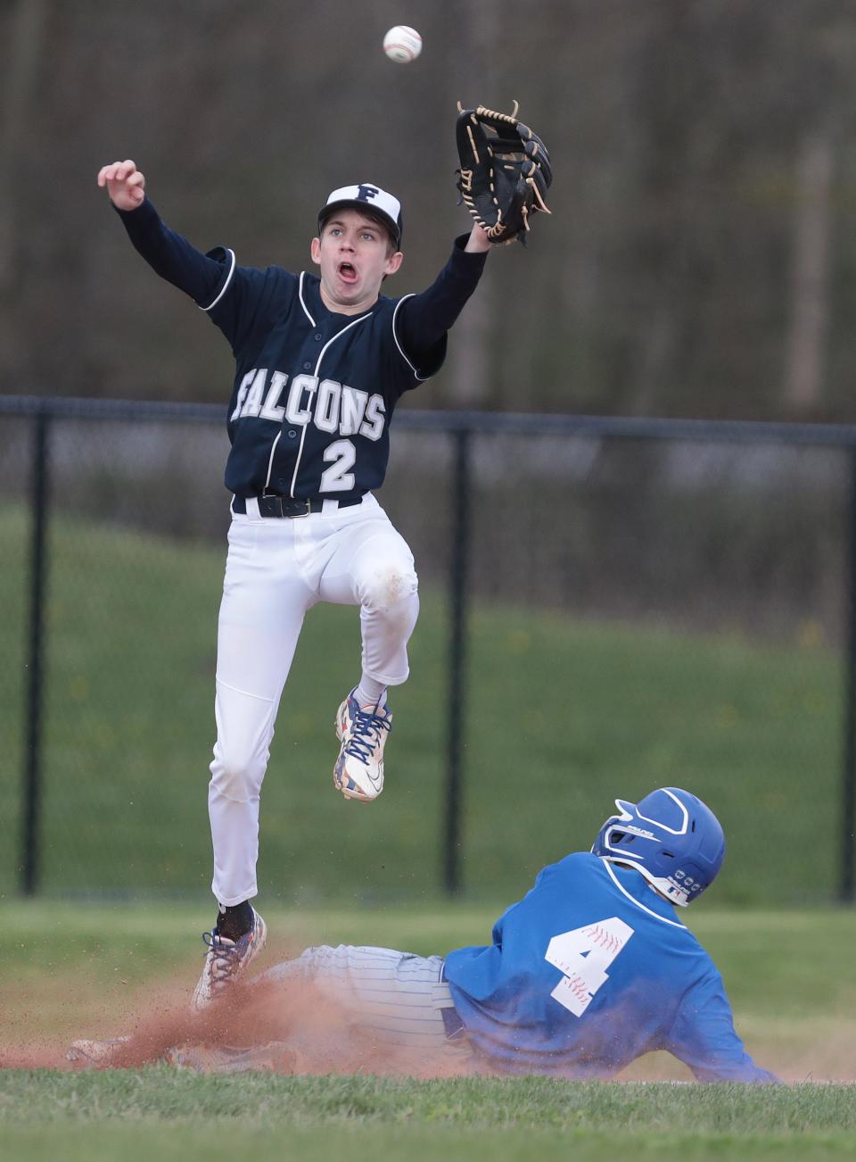 Tuslaw's Tyler Simmons slides safely into second ahead of a throw to Fairless' Brent Hrynko during Wednesday's game.