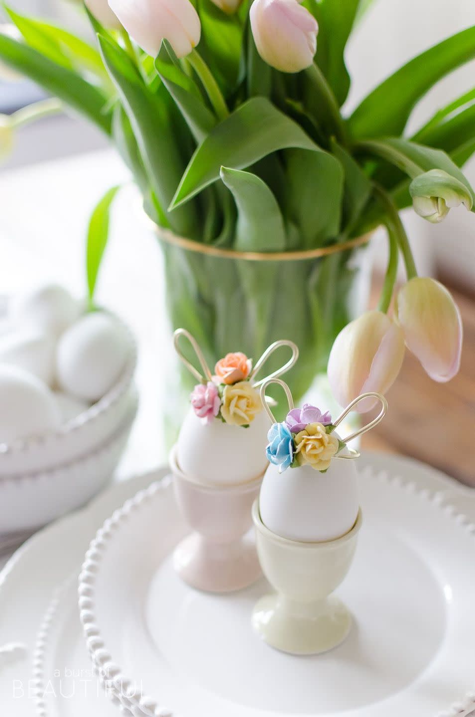 eggs with flowers and bunny ears for easter centerpiece