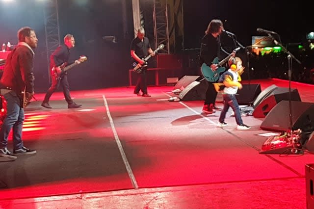 Boy, five, delights crowd by dancing on stage with Foo Fighters