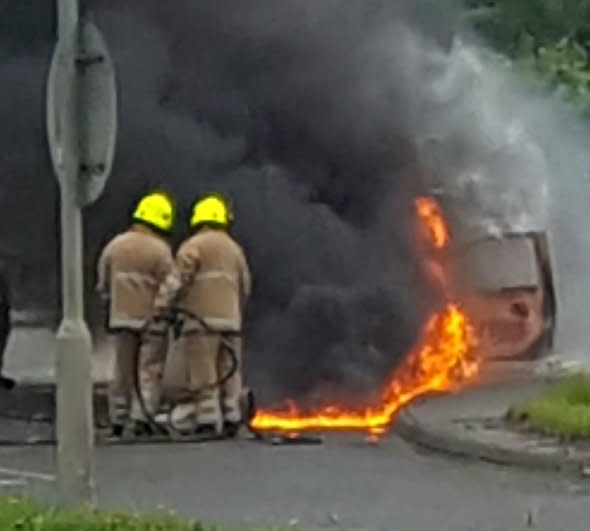 A driver has told of the terrifying moment she escaped from her burning car moments before it exploded on a busy roundabout.  See CENTRE PRESS story CPBURST.  Lizzie Connell and her husband cheated death after her Renault Twingo ground to a halt as flames leapt from the bonnet.  The 29-year-old lawyer and her husband Andy scrambled to safety minutes before their car was fully on fire - and then exploded on the Newbridge Roundabout, Edinburgh.  Fellow motorists stopped to help amid fears that someone was trapped inside, forcing the couple to desperately warn them to keep back.