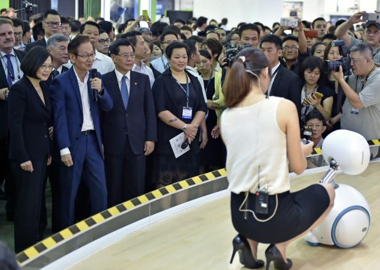 The Asus Zenbo robot steals the show as it serenades Taiwan's President Tsai Ing-wen (L) at the Computex computer exhibition on May 31, 2016 in Taipei