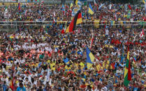 <p>Pilgrims and faithful attend the opening Mass for the World Youth Day in Krakow, Poland, July 26, 2016. (AP Photo/Czarek Sokolowski)</p>