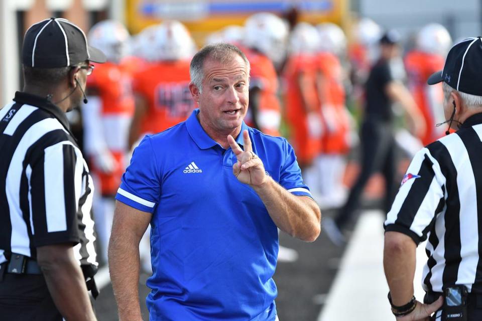 Presbyterian head football coach Kevin Kelly talks with referees before the start of the game with Campbell. The Presbyterian Blue Hose and the Campbell Fighting Camels met in a non-conference football game in Buies Creek, N.C. on September 18, 2021.