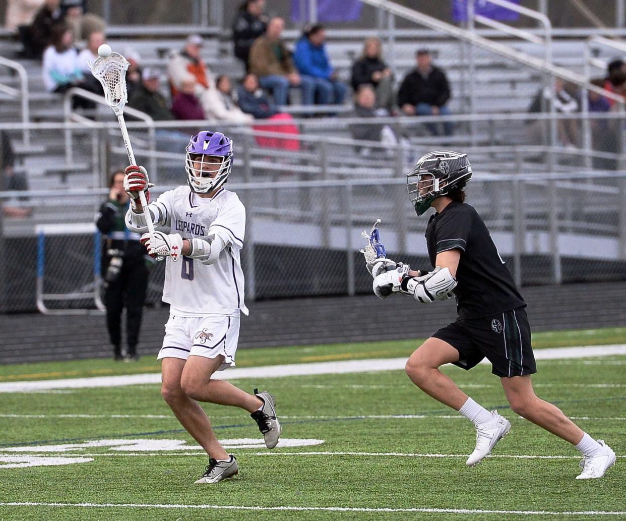 Smithsburg's Zachary Linn makes a pass as Tuscarora's Cameron Connors defends.