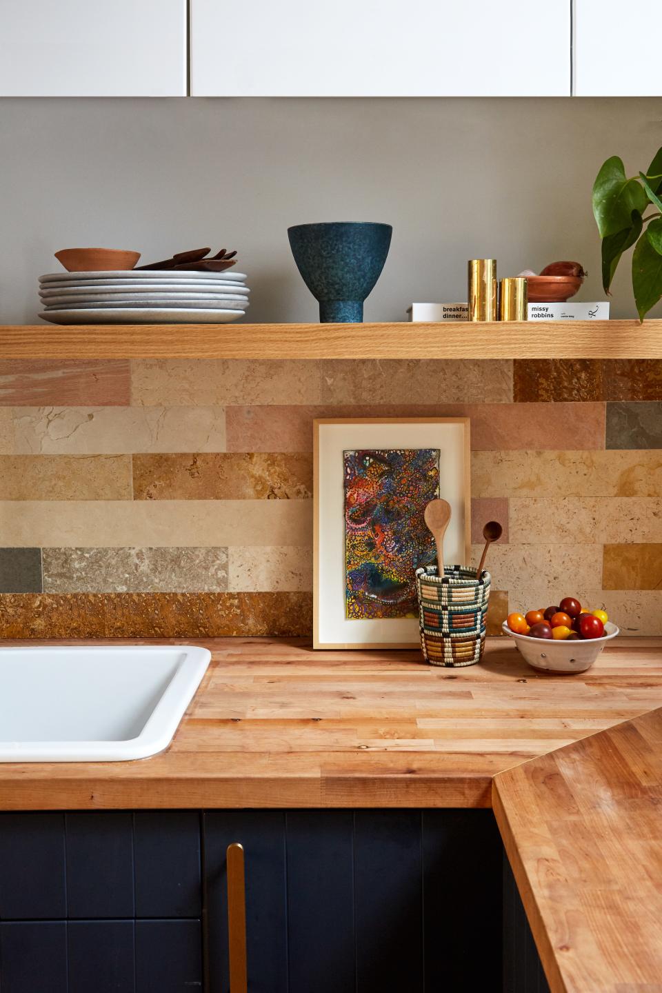 “I love mixed media that don’t necessarily go together,” Lyndsey says. “The backslash with the butcher’s block is a slightly unconventional pairing, but I liked the textures and the warmer color palette.”