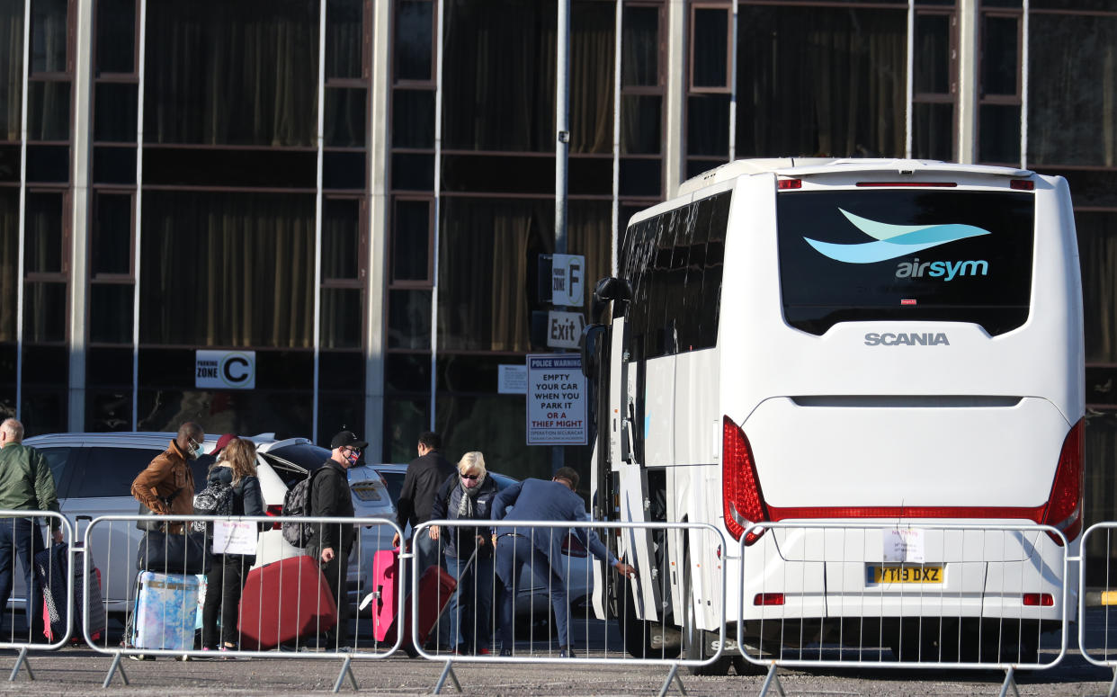 Guests leave the Radisson Blu Edwardian hotel, near Heathrow Airport, London, after completing their 10-day stay at the Government-designated quarantine hotel. Picture date: Friday February 26, 2021. (Photo by Andrew Matthews/PA Images via Getty Images)