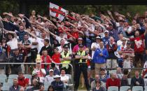 England supporters from the "Barmy Army" fan organisation cheer during the fifth day's play in the second Ashes cricket test between England and Australia at the Adelaide Oval December 9, 2013. REUTERS/David Gray (AUSTRALIA - Tags: SPORT CRICKET)