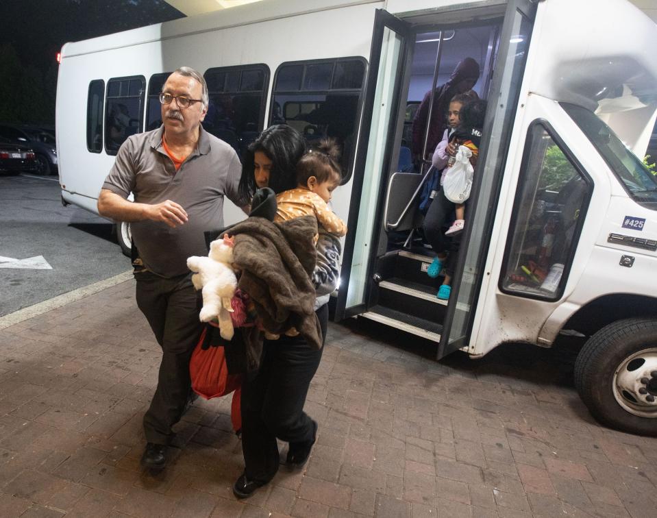 Families of asylum seekers are led into the Ramada hotel in Yonkers onkers May 15, 2023. The families were being housed in New York City.