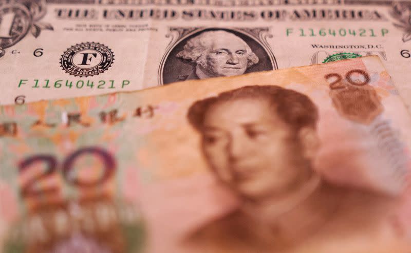 FILE PHOTO: Illustration shows U.S. dollar and Chinese Yuan banknotes