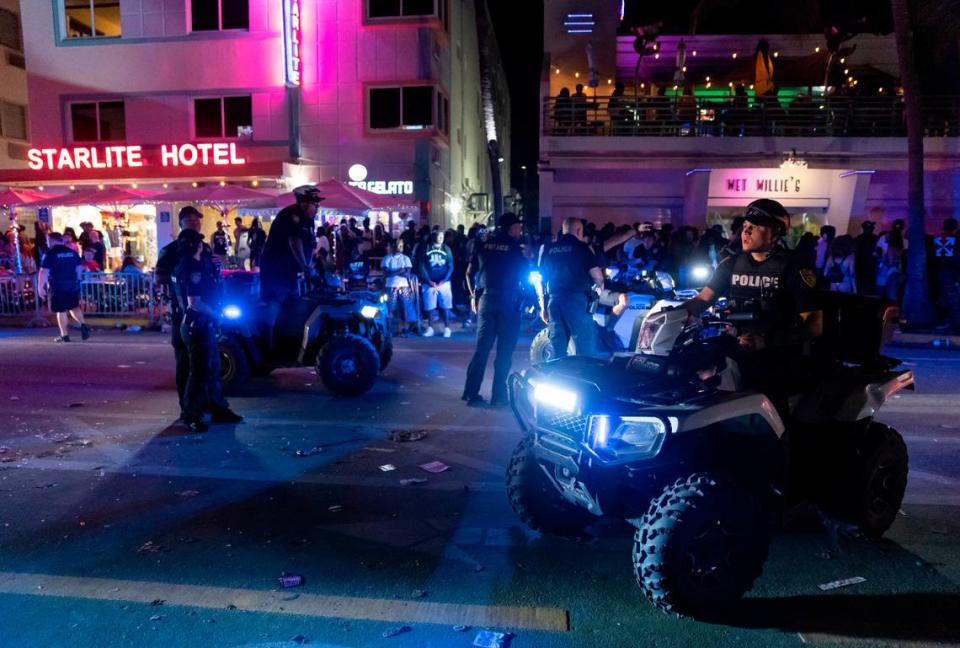 In this file photo from 2023, police work to disperse a large crowd and reopen traffic on Ocean Drive during spring break in Miami Beach.
