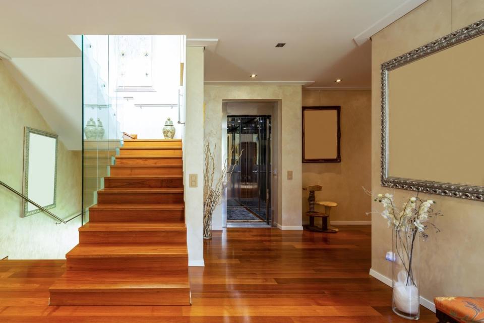 A view of a home's interior with a home elevator in the background.