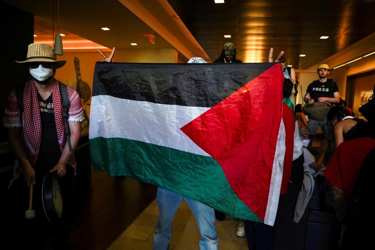 <span>Demonstrators chant inside Emory University’s admissions building in Atlanta, Georgia, on 1 May 2024.</span><span>Photograph: Megan Varner/Reuters</span>