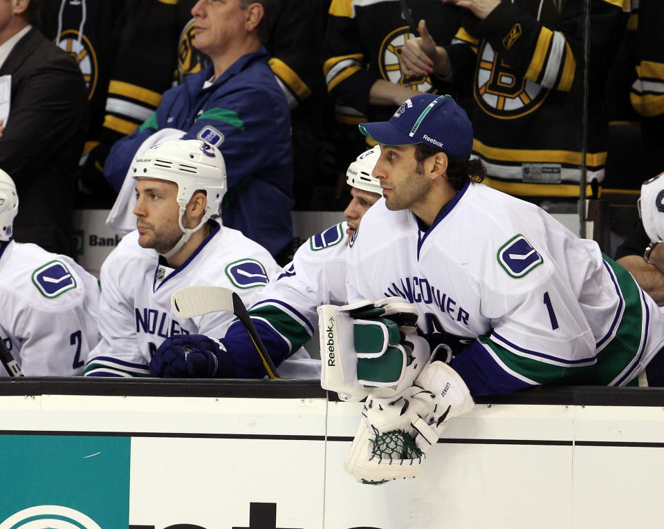 BOSTON, MA - JANUARY 07: Roberto Luongo #1 of the Vancouver Canucks looks on from the bench in the first period against the Boston Bruins on January 7, 2012 at TD Garden in Boston, Massachusetts. (Photo by Elsa/Getty Images)