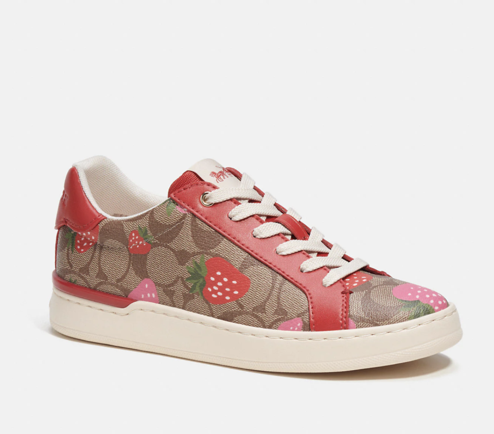 Clip Low Top Sneaker in Signature Canvas with Wild Strawberry Print (Photo via Coach Outlet)