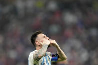 Argentina's Lionel Messi reacts after winning the World Cup final soccer match between Argentina and France at the Lusail Stadium in Lusail, Qatar, Sunday, Dec. 18, 2022. Argentina won 4-2 in a penalty shootout after the match ended tied 3-3. (AP Photo/Martin Meissner)