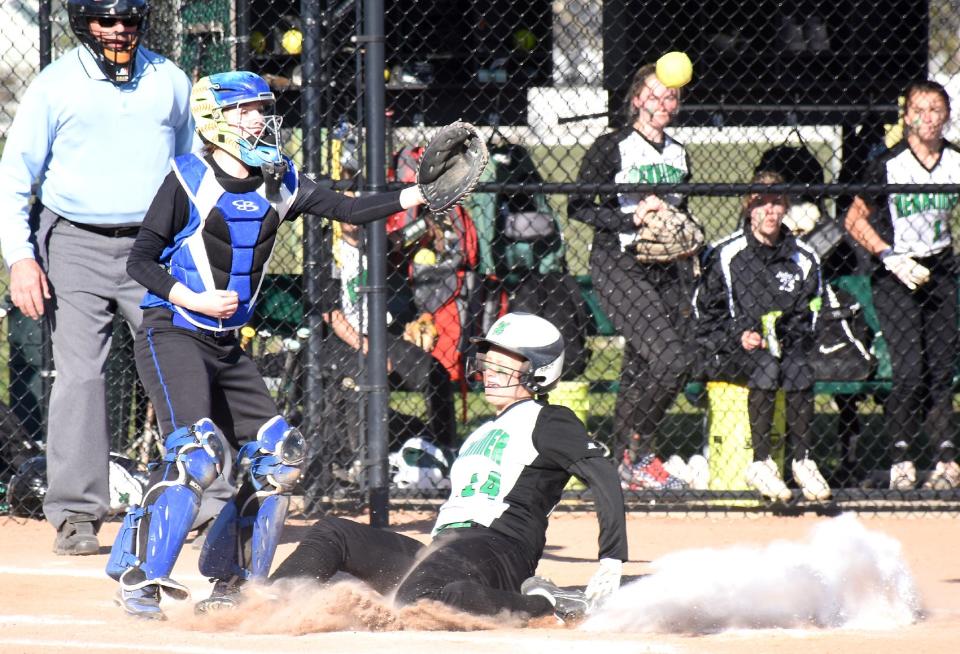 Herkimer Magician Arrissa Bunker slides home safely during the fourth inning Thursday with Dolgeville's catcher reaching for the throw.