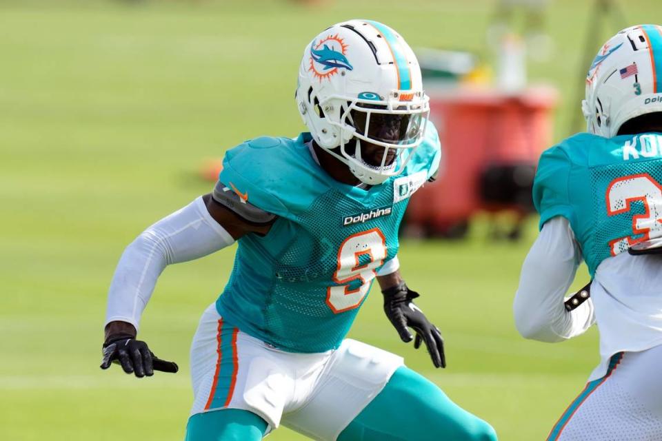 Miami Dolphins’ Noah Igbinoghene (9) works against Kader Kohou during an NFL football training camp practice Wednesday, Aug. 10, 2022, in Tampa, Fla. (AP Photo/Chris O’Meara)