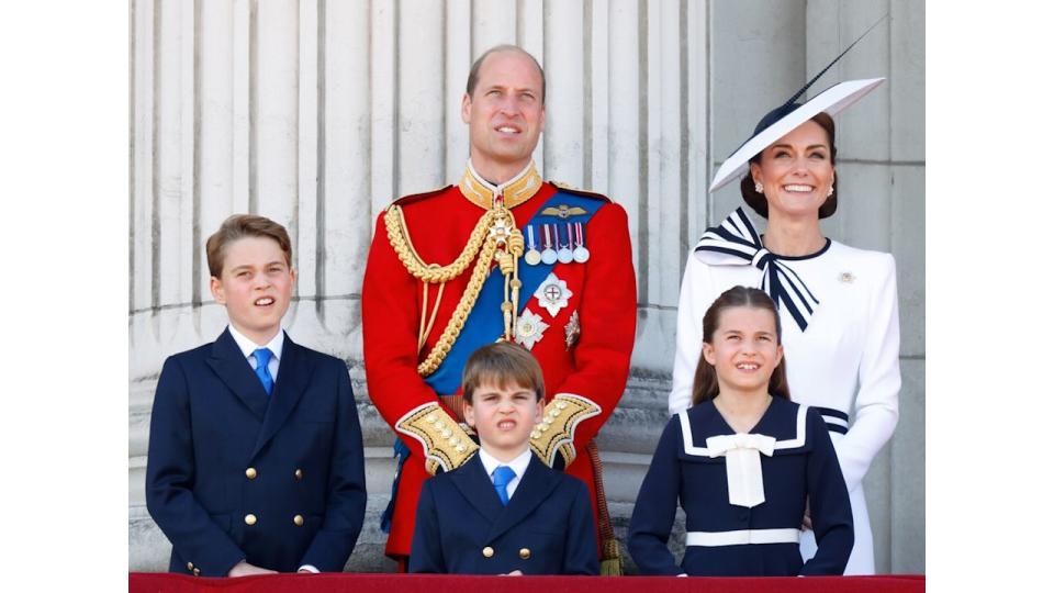 Charlotte and William grinning on balcony