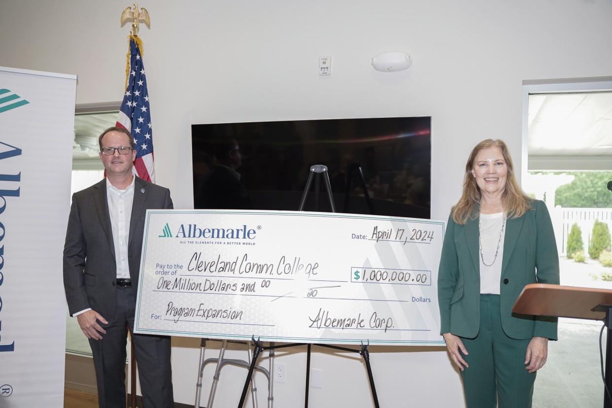 Cleveland Community College President Jason Hurst with Albemarle's Ellen Lenny-Pessagno, during the unveiling of a $1 million donation by Albemarle.