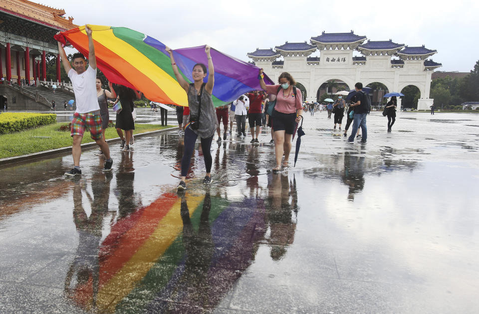 Participants march during the "Taiwan Pride March for the World!" at Liberty Square at the CKS Memorial Hall in Taipei, Taiwan, Sunday, June 28, 2020. This year marks the first Gay Pride march in Chicago 1970, and due to the COVID-19 lockdown, Taiwan is one of the very few countries to host the world's only physical Gay Pride. (AP Photo/Chiang Ying-ying)