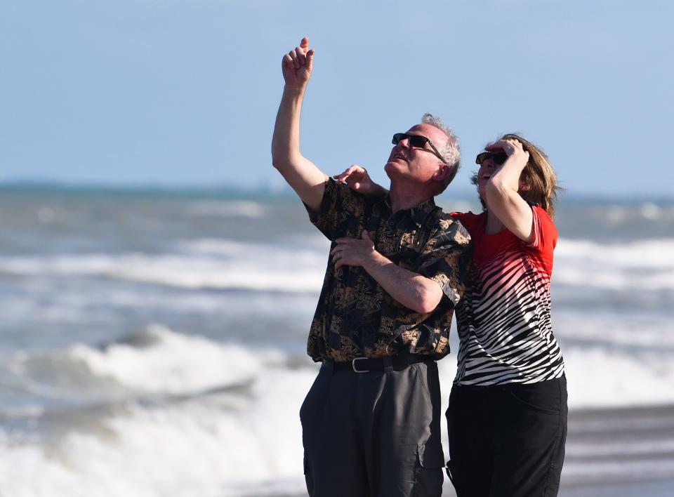 Cocoa Beach spectators watch SpaceX send a Falcon 9 rocket skyward Wednesday from pad 39A at Kennedy Space Center.