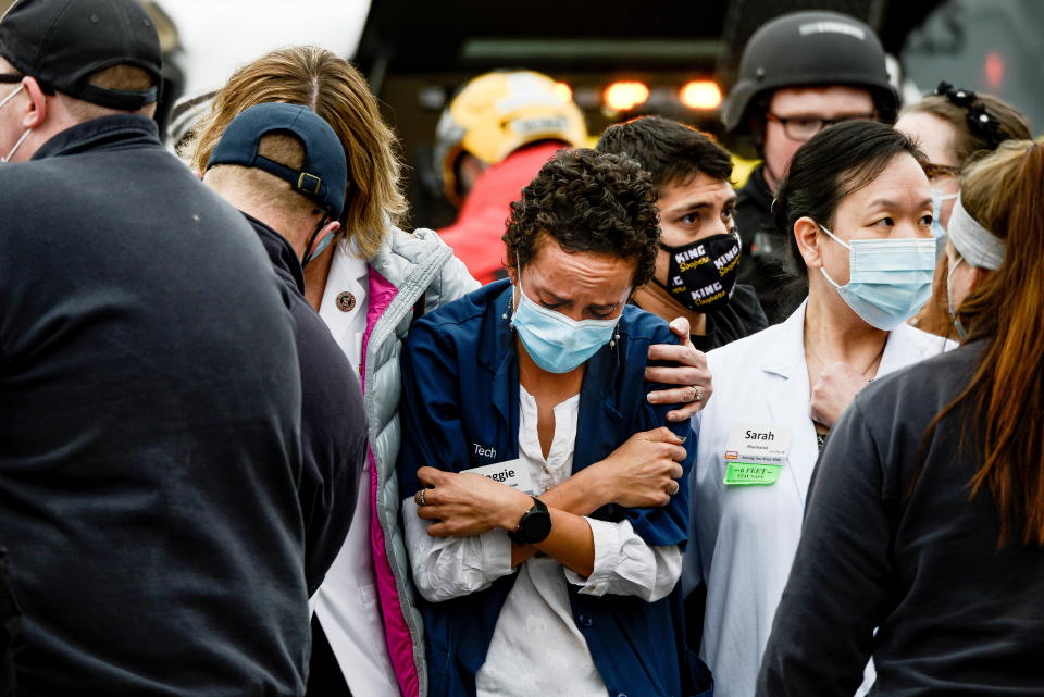 A woman consoles a King Soopers pharmacy technician after a shooting at the grocery store in Boulder, Colorado, on Monday.  (Photo: MICHAEL CIAGLO/USA TODAY NETWORK/REUTERS)