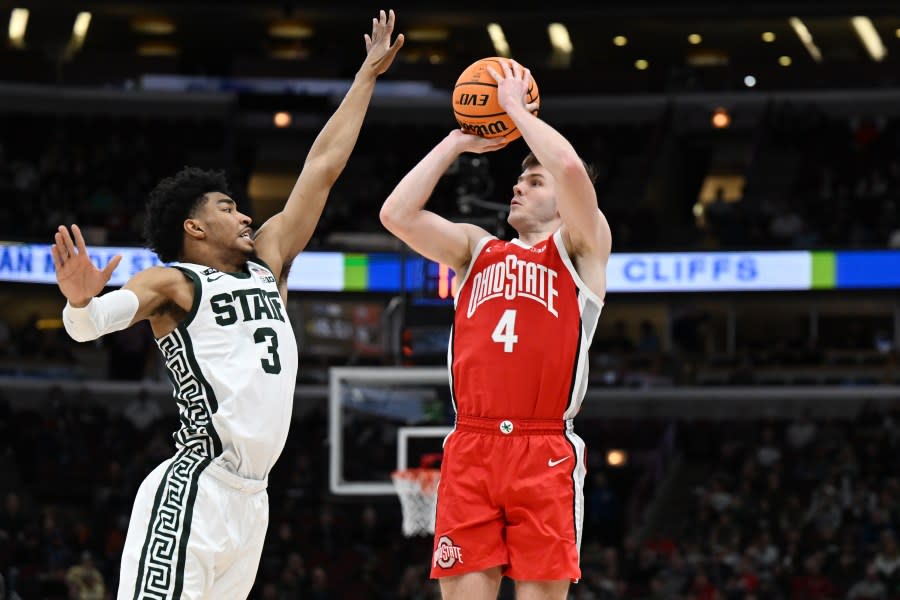 CHICAGO, ILLINOIS – MARCH 10: Sean McNeil #4 of the Ohio State Buckeyes shoots against Jaden Akins #3 of the Michigan State Spartans during the second half in the quarterfinals of the Big Ten Tournament at United Center on March 10, 2023 in Chicago, Illinois. (Photo by Quinn Harris/Getty Images)