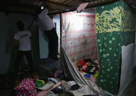 Jail guards sift through every corner as they search the belongings of detainees for illegal contraband inside the Manila City Jail in metro Manila, Philippines October 16, 2017. REUTERS/Romeo Ranoco