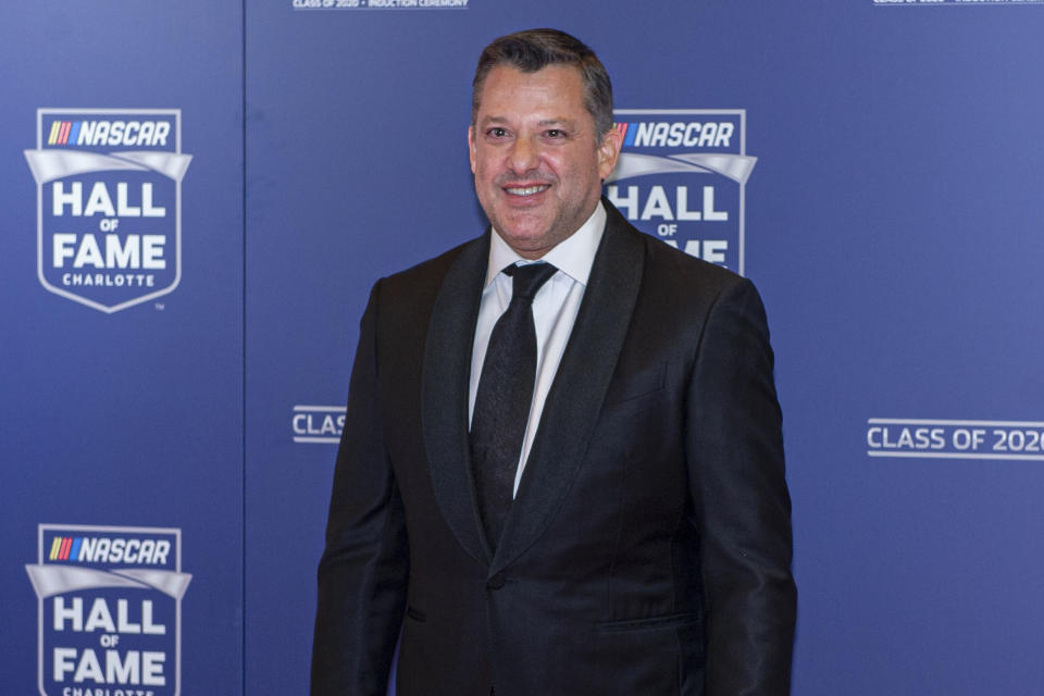 NASCAR Hall of Fame inductee Tony Stewart poses for pictures prior to the induction ceremony in Charlotte, N.C., Friday, Jan. 31, 2020. (AP Photo/Mike McCarn)