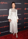 <p>Olivia Wilde wore a polka dot print Valentino dress and sparkly silver heels to attend the Save The Children Illumination Gala.</p>