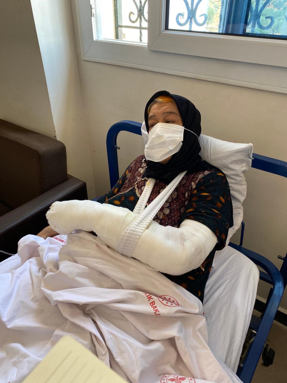 Daid al Kamal, 60,  went to the hospital to recover from shock after her neighbourhood was struck by a barrage of rockets in Afrin, northwest Syria. Then rockets hit the hospital. She recovers at another hospital (Borzou Daragahi)