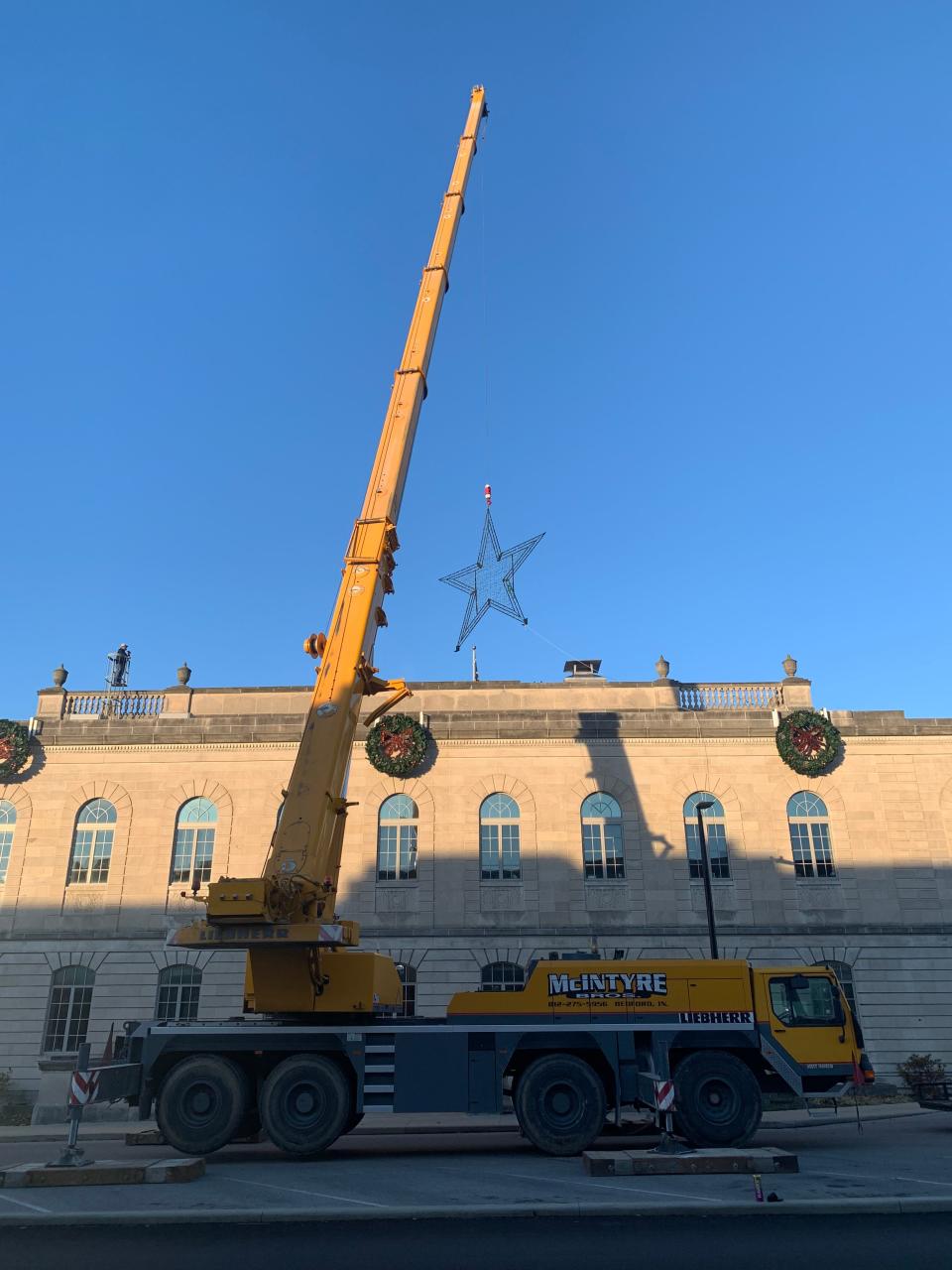 McIntyre Bros. Construction provided a crane to lift the star created by welding students at North Lawrence Career Center.