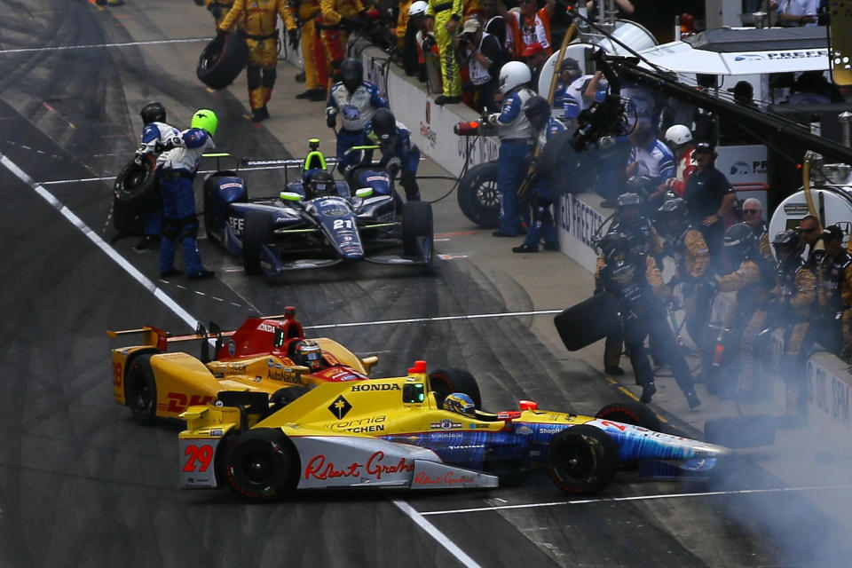 Ryan Hunter-Reay, driver of the #28 DHL Andretti Autosport Honda, and Towsend Bell, driver of the #29 Andretti Autosport Honda, make contact leaving the pits during the 100th running of the Indianapolis 500 at Indianapolis Motorspeedway on May 29, 2016, in Indianapolis, Indiana. (Photo by Chris Graythen/Getty Images)