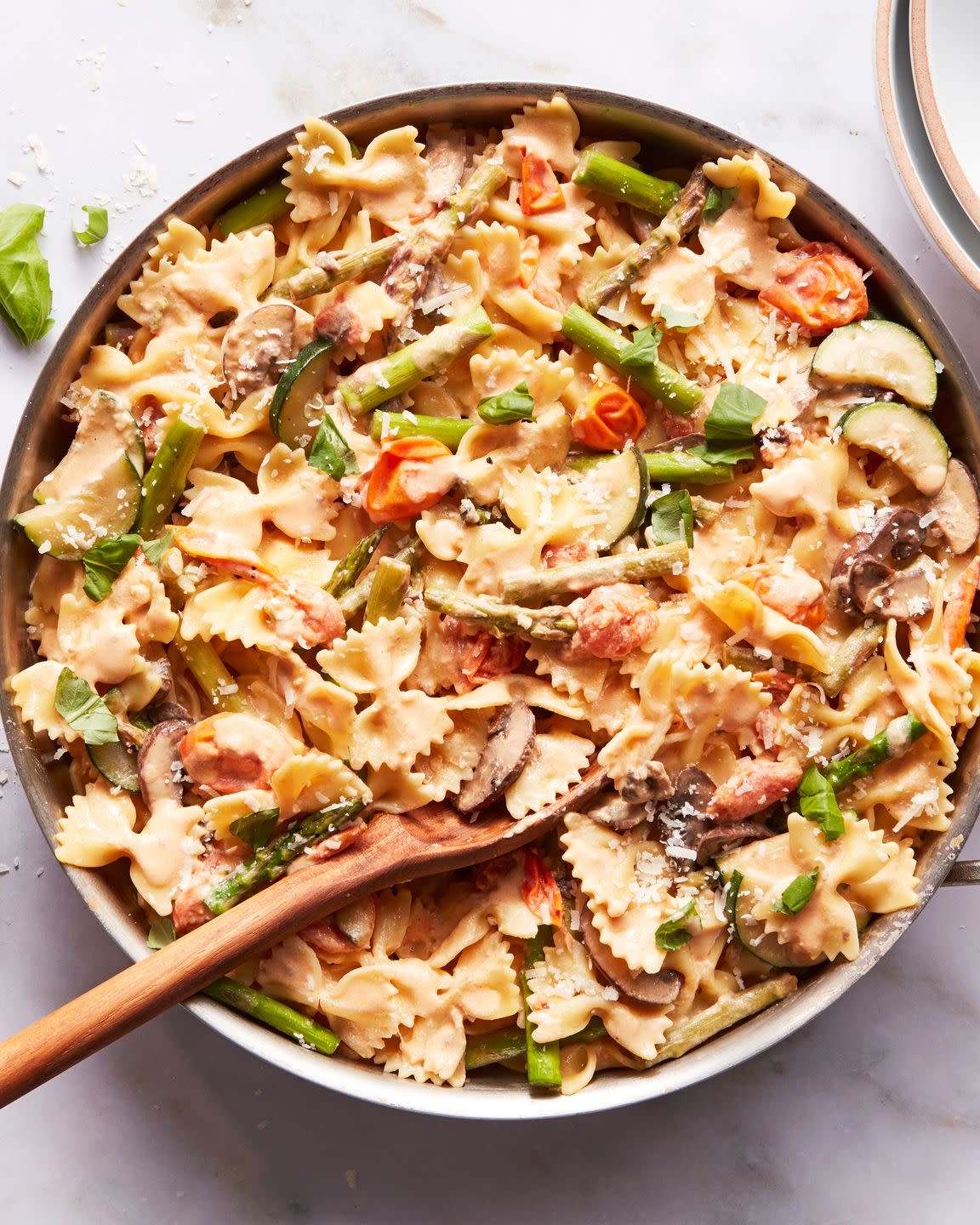bowtie pasta with asparagus, tomatoes, zucchini and parmesan