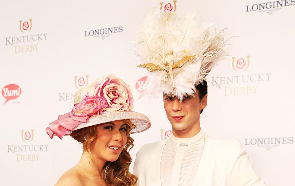 Former ice skaters Tara Lipinski and Johnny Weir arrive on the red carpet before the Kentucky Derby in 2014.