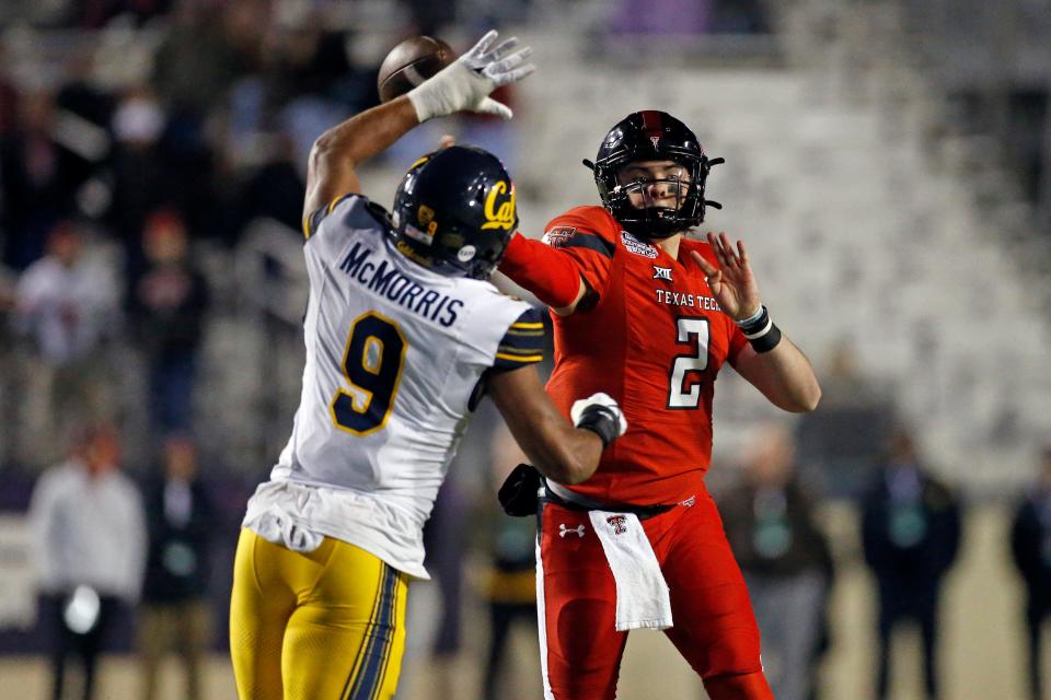Texas Tech Red Raiders quarterback Behren Morton (2) passes the ball as California Golden Bears defensive back Patrick McMorris (9) attempts to make the tackle during the second half at Independence Stadium on Dec. 16, 2023, in Shreveport, LA.