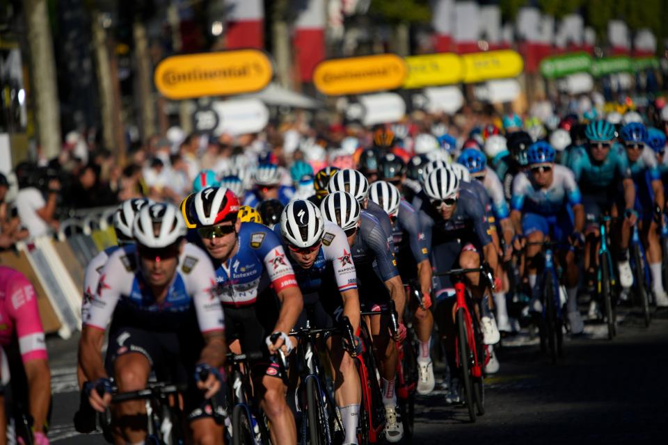 The pack rides during the twenty-first stage of the Tour de France (AP)