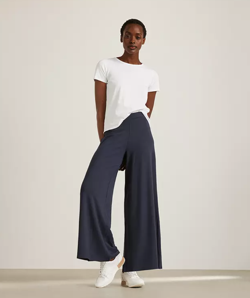 The comfy trousers come in two staple colours: navy and black. (John Lewis & Partners)