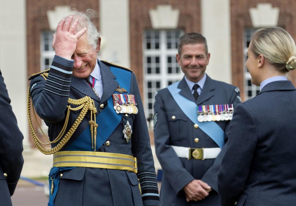 <p>Prince Charles has a laugh at the graduation ceremony of the Queen's Squadron at RAF College Cranwell.</p>