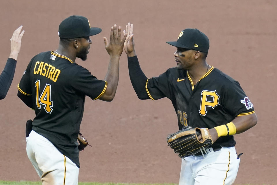 Pittsburgh Pirates' Miguel Andujar, right, celebrates with Rodolfo Castro (14) after the team's 5-3 win over the St. Louis Cardinals in a baseball game Wednesday, Oct. 5, 2022, in Pittsburgh. (AP Photo/Keith Srakocic)