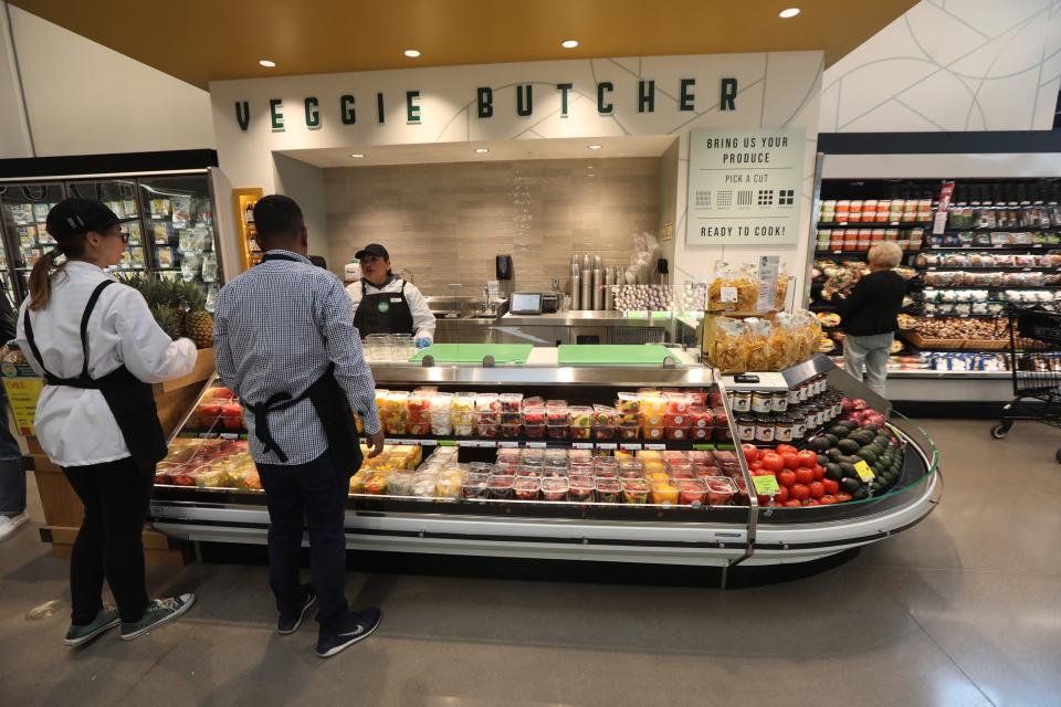Veggie butcher area at Whole Foods Market cuts fruits and vegetables to order.