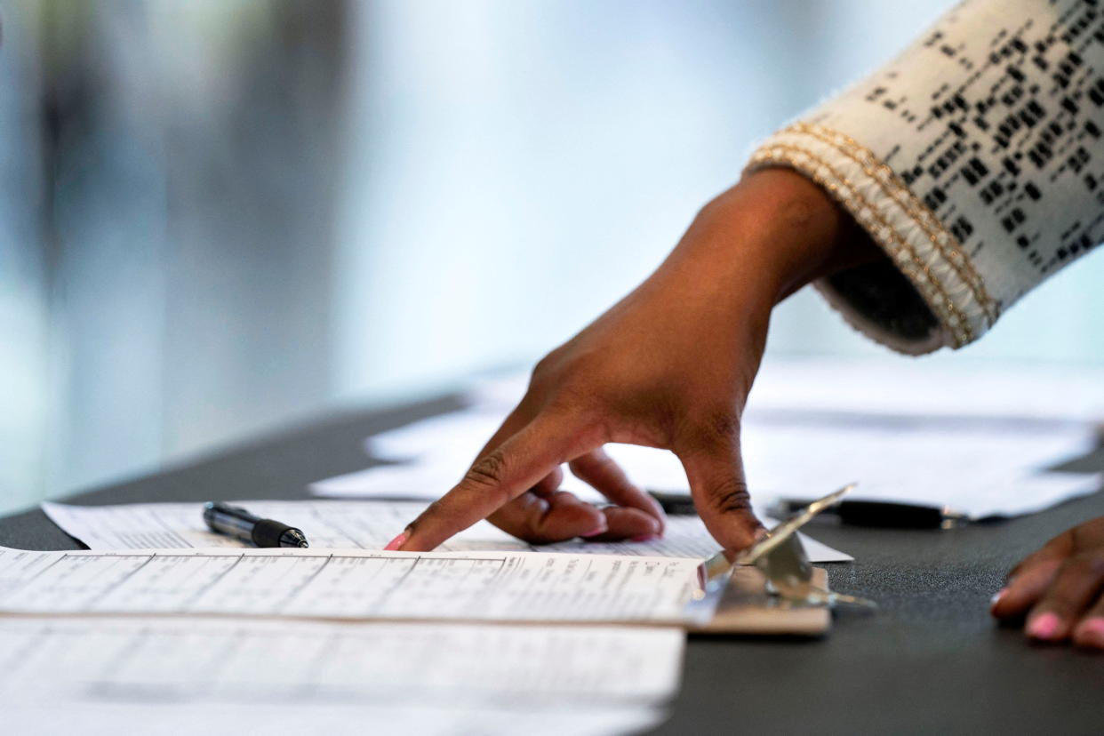 A volunteer from No Labels, a third-party political group, collects signatures at the University of Maryland, Baltimore County to gather support ahead of the 2024 presidential election